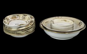 Fifteen Pieces of Gilt Decorated Tableware comprising six small bowls, six finger bowls,