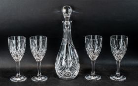 Good Quality Crystal Glass Decanter Set comprising 4 large wine glasses and a decanter.