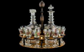 Collection of Antique Decorated Liqueur Glasses & Decanters, housed in a wooden stand,