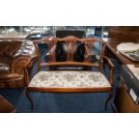 Edwardian Mahogany Two Seater Salon Sofa with a delicate fretworked splat back, and shaped arms,