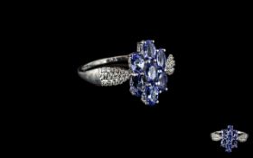 Tanzanite Cluster 9ct White Gold Ring, the centrepiece comprising seven oval cut tanzanites of