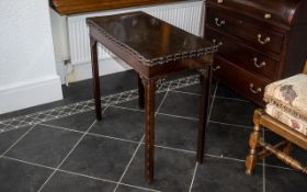 An Edwardian Mahogany Chippindale Revival Card Table with an inner green baize top,