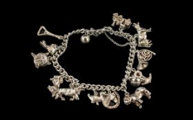Vintage - Sterling Silver Charm Bracelet, Loaded with 12 Silver Charms.