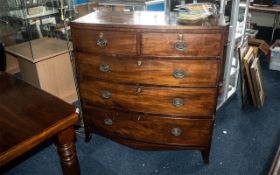 A 19th Century Mahogany bow Fronted Chest of Drawers, two short over three long graduating drawers,