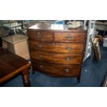 A 19th Century Mahogany bow Fronted Chest of Drawers, two short over three long graduating drawers,