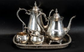 Four Piece Silver Plated Tea Set stamped Oneida, on a plated gallery tray with embossed decoration.