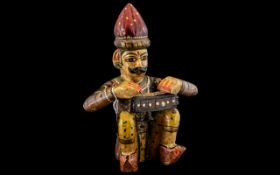 Indian Carved & Painted Wood Figure of a seated musician in traditional style.