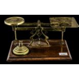 Large Antique Brass Postal Scales by Avery, on a mahogany base with a set of brass weights.