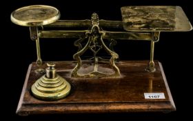 Large Antique Brass Postal Scales by Avery, on a mahogany base with a set of brass weights.