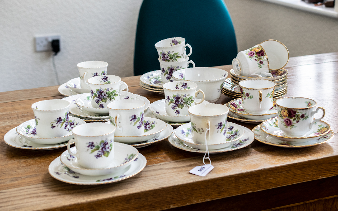 Radfordian Tea Service, comprising seven trios of cup, saucer and side plates, a large cake plate