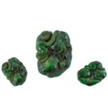 A Dark Green Jade Carving depicting a stylised monkey and Salamander. Measures 2 by 1.5 inches.