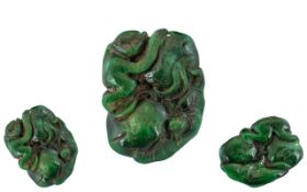 A Dark Green Jade Carving depicting a stylised monkey and Salamander. Measures 2 by 1.5 inches.