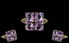 Ladies 9ct Gold - Attractive Amethyst Set Dress Ring of Square Form. Full Hallmark for 9.375.