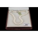 String of White Cultured Pearls Well Matched with Clasp. 15 Inches In length. Boxed.