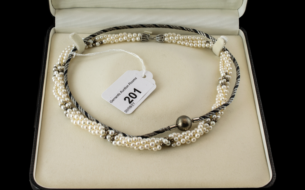 Four Strand Twist Pearls, by Whittles Jewellers of Preston, in presentation case.