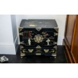 A Chinese Black Lacquered Cabinet, painted floral gilt decoration in enamels,