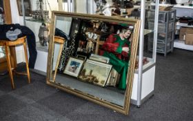 A Large Gilt Framed Bevelled Glass Mirror. Measures 41" x 52".