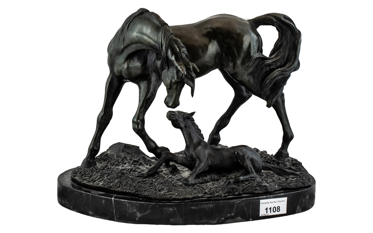 A Modern Bronze Figure Group Horse and Foal, on a naturalistic base, raised on a marble plinth.