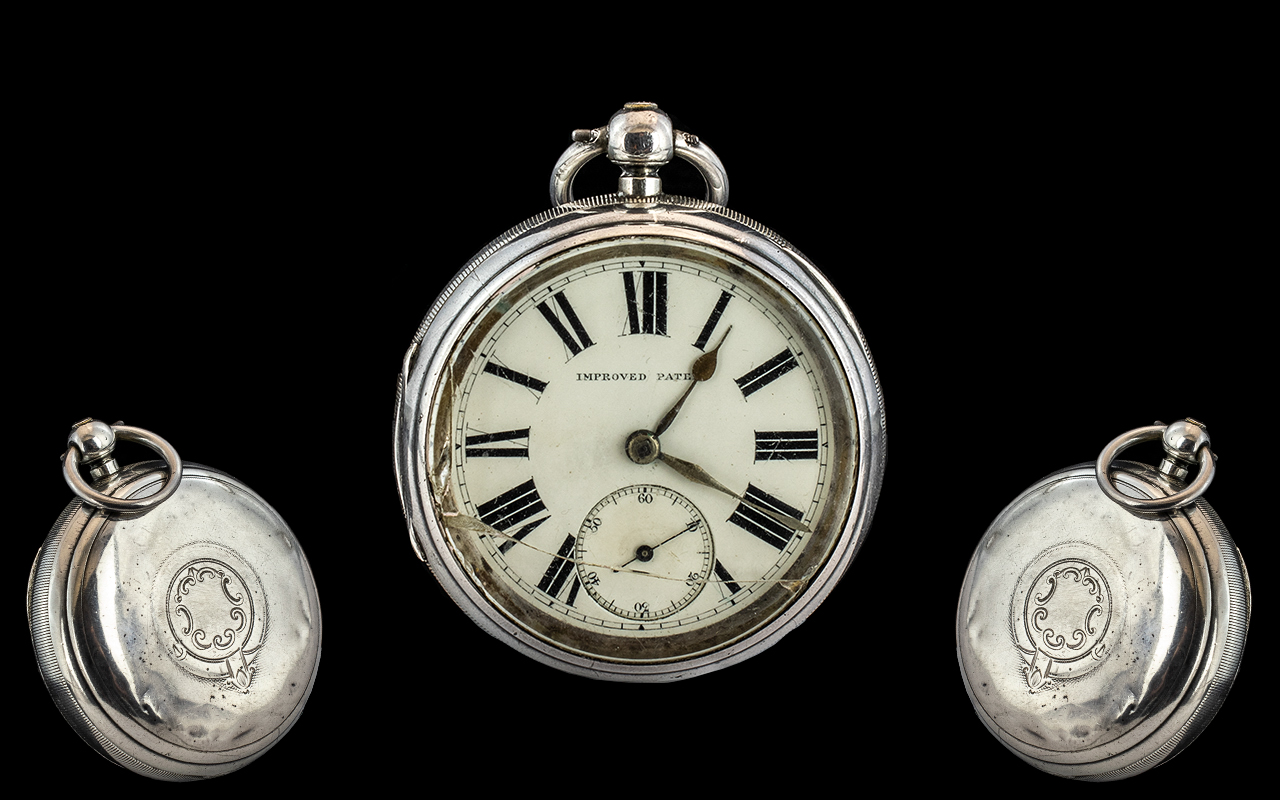 A Victorian Silver Open Faced Pocket Watch, white enamel dial, Roman Numerals with subsidiary