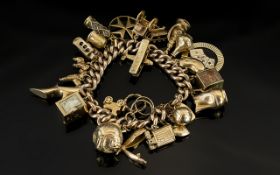 A Vintage 9ct Gold Curb Bracelet Loaded with 25 Superior Quality 9ct Gold Charms. Some Expensive