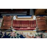 Charles Dickens Books, comprising two complete sets of works, in burgundy hard covers,