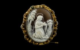 A Fine Quality Antique Oval Shaped Devotional Carved Cameo Depicting a Lady Saint or Mary Reading