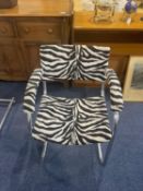 A Pel Chrome Cantilever Baushause Style Armchair. Covered in zebra print fabric.