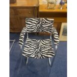 A Pel Chrome Cantilever Baushause Style Armchair. Covered in zebra print fabric.