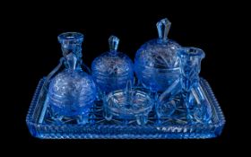 Blue Glass Dressing Table Set, comprising a glass tray, pair of candlesticks,