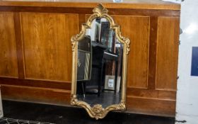 Rococo Style Wall Mirror of Large Size, a lovely and striking, ornate mirror with elaborate borders;