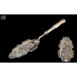 An Antique 19th Century Austrian Fish Slice - Embossed Shell & Floral with Cherub and Sea God.