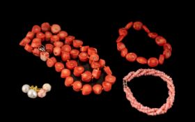 Collection of Coral Jewellery comprising a red coral necklace, a pink coral bracelet and a pair of