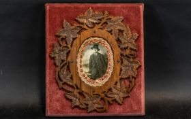 A Mock Up Picture Frame carved leaf fretwork applied to a velvet back frame with a central photo