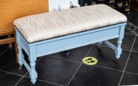 An Edwardian Painted Piano Duet Stool with upholstered seat and lift up lid.