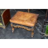 A William & Mary Style Cabriole Leg Stool with a leather seat, worn, with brass studs. Height 14".