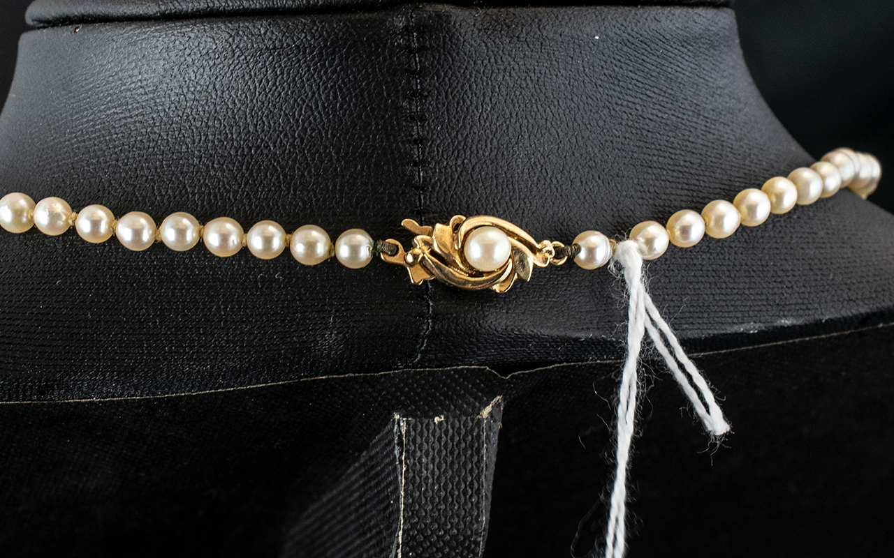 A Single Strand 16 inch Pearl Necklace with 9ct gold clasp. - Image 2 of 2