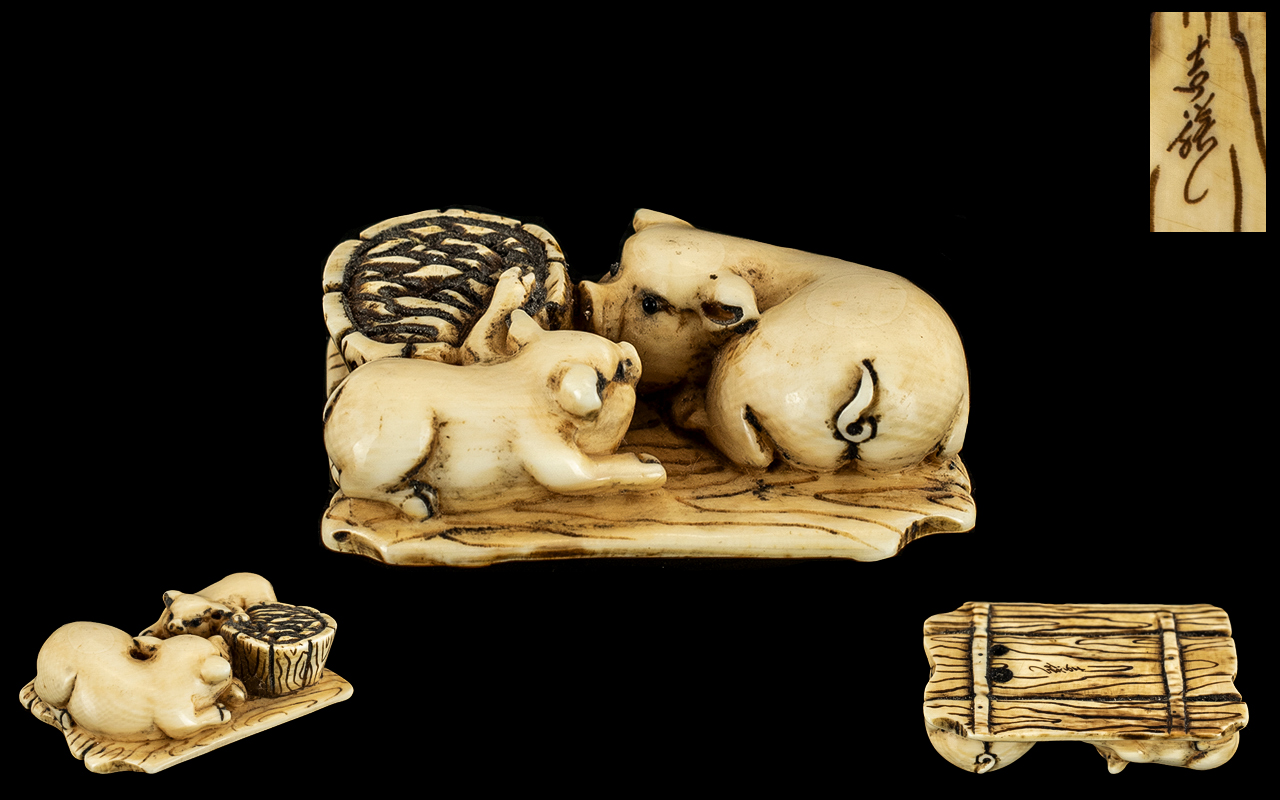 Japanese Meiji Period Carved Ivory Netsuke of unusual form depicting a sow with her piglet sitting