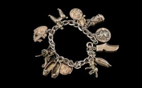 Vintage Sterling Silver Charm Bracelet Loaded with 11 Silver Charms. All Marked for Sterling Silver.