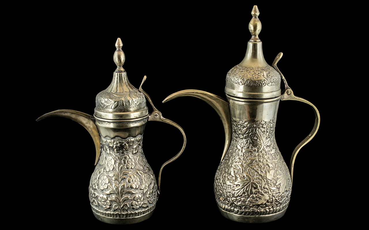 Two Middle Eastern Embossed Coffee Pots, With Finial Lids, 12 & 10 Inches. Stamped to Base G.