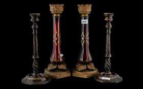 A Pair of Ruby Glass Candle Holders, gilt painted ruby glass supports, with metal mounts. Height