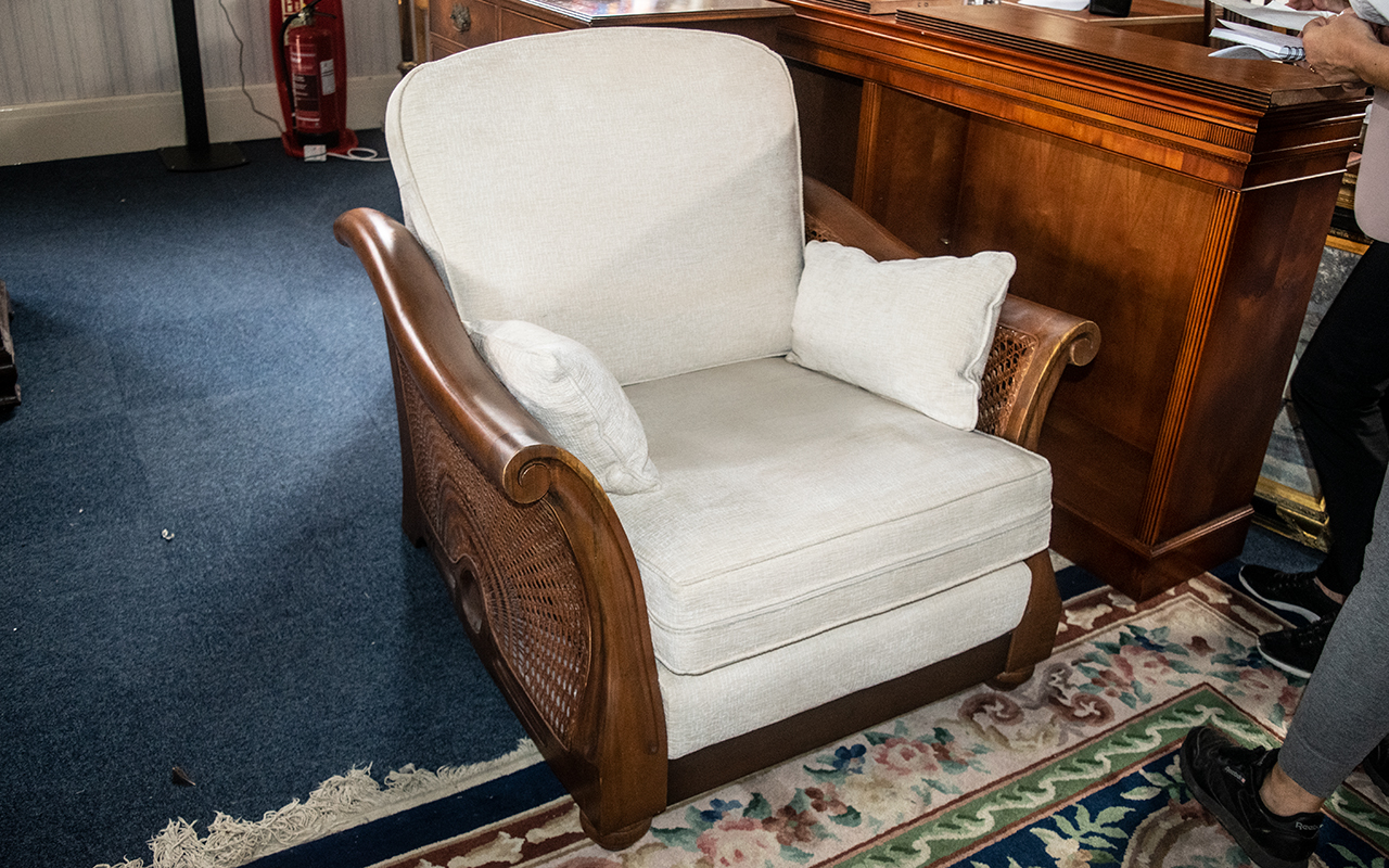 A Large Teak Framed Bergere Upholstered Armchair with Loose Cushion of Contemporary Shape.