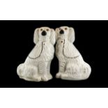 A Large Pair of Staffordshire Spaniels,