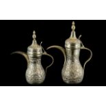 Two Middle Eastern Embossed Coffee Pots,