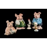 Three Money Boxes and Two Small Porcelai