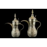 Two Middle Eastern Embossed Coffee Pots, With Finial Lids, 12 & 10 Inches. Stamped to Base G.