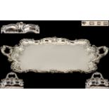 A Large & Impressive Double Handled Robust Silver Serving Tray, with a finely cast Rococo swept