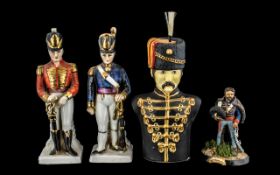 Military Interest: Pair of Decorated Porcelain Soldier Figures, highlighted in gilt,