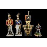 Military Interest: Pair of Decorated Porcelain Soldier Figures, highlighted in gilt,