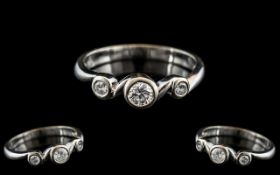 Ladies 18ct White Gold 3 Stone Diamond Ring of Contemporary Design. Marked 750 to Interior of Shank.