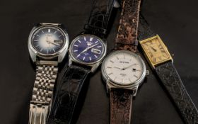 Four Vintage Wristwatches comprising two Seiko, 21 an 17 jewels, a large dial Rhythm auto.